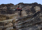 Climber in the crux of Traveler Buttress' first pitch