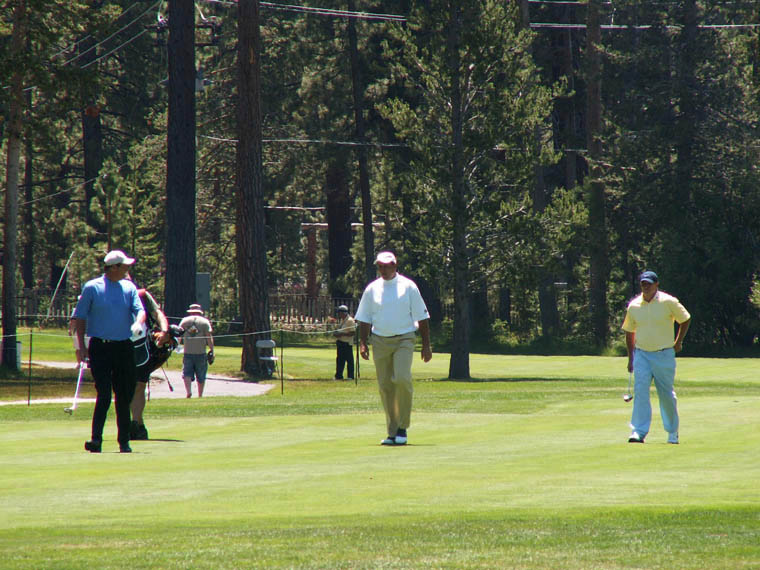 Second Day Leaders walking in fairway