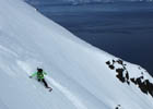 Snowboarder dropping down to the Cross