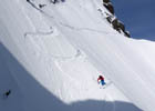 Skier dropping into the Cross of Mount Tallac