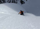 Skier dropping into the Cross of Mount Tallac