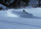 Rider slashes under the Cross of Mount Tallac